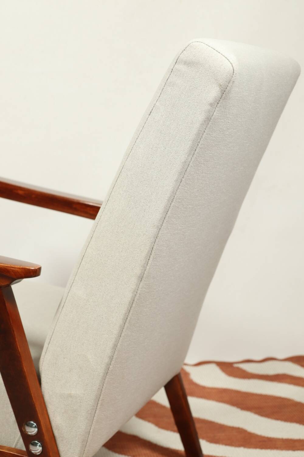 Vintage light gray armchair dark wood Scandinavian design 1970