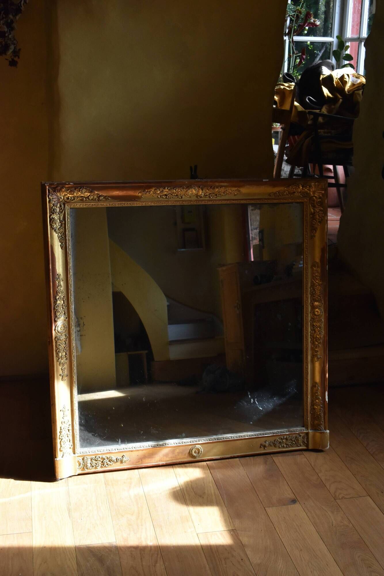 Large gilded Empire mirror from the 19th century.