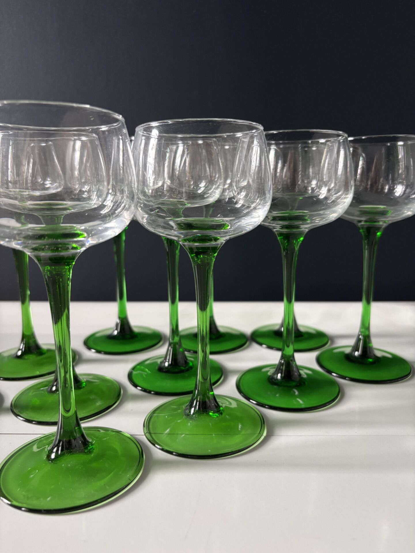 Set of 12 Alsatian Roemer glasses with green stems.