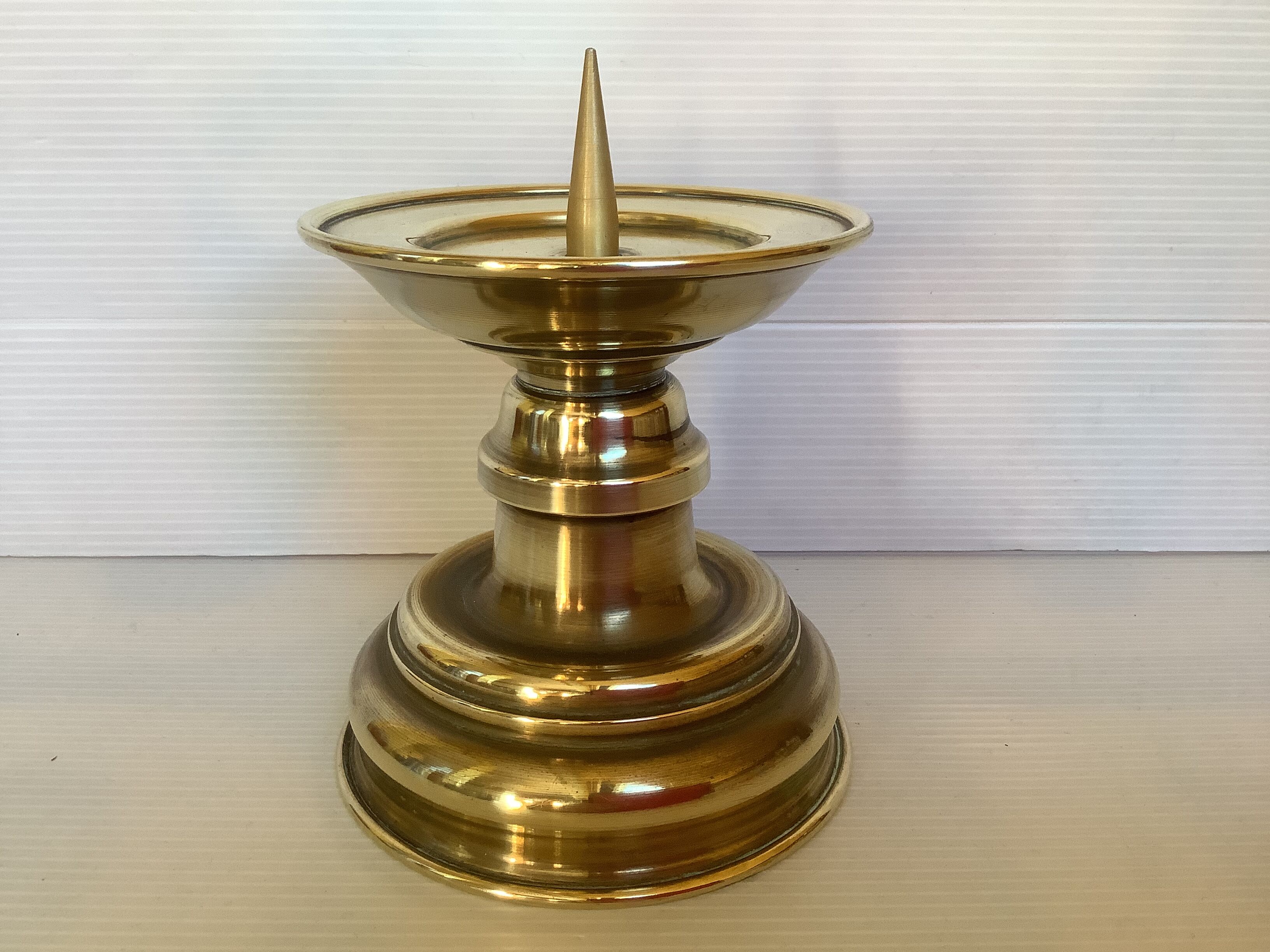 Old brass candle pique