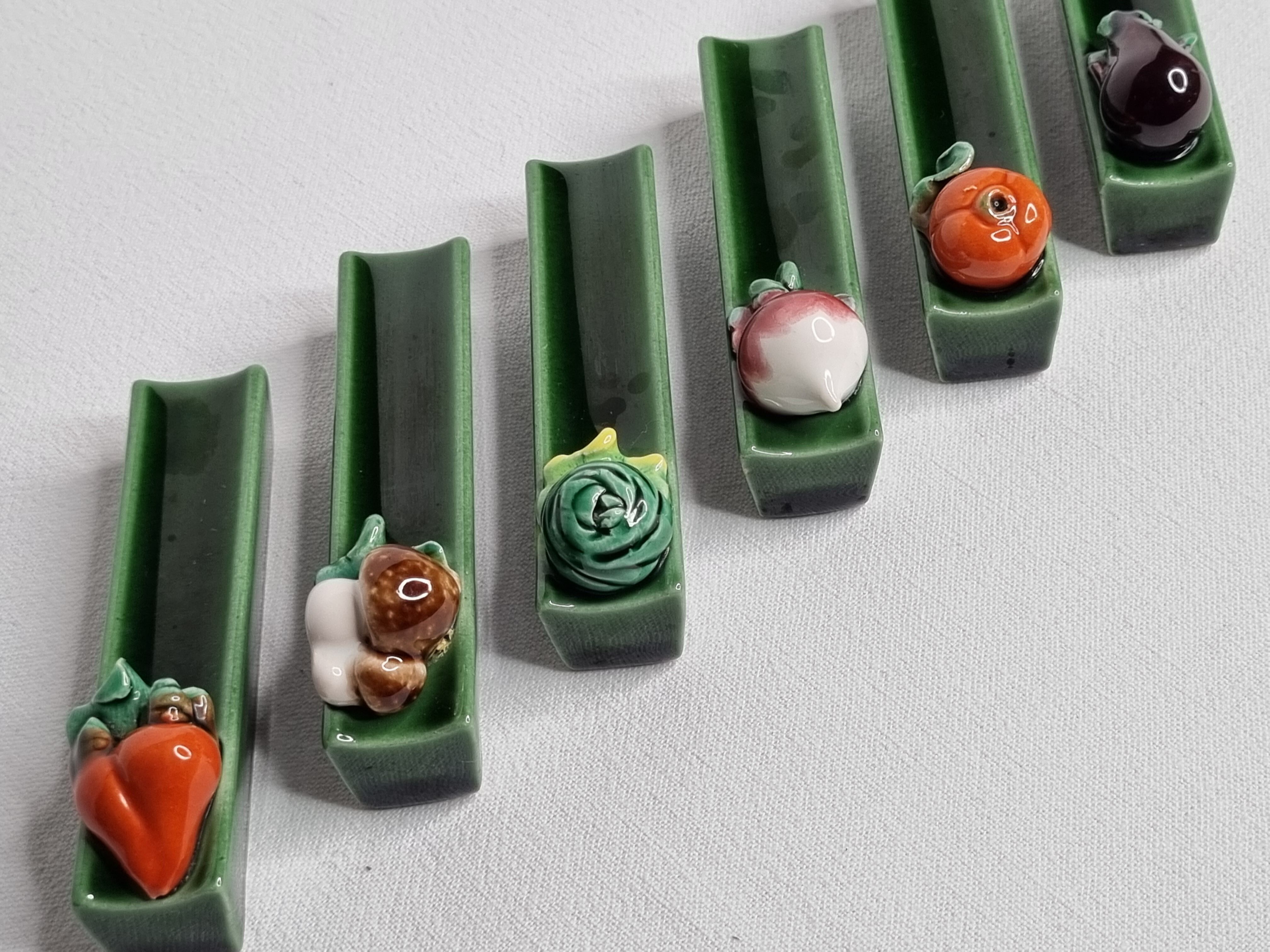Set of six enamelled ceramic knife holders decorated with vegetables from the sun