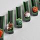 Set of six enamelled ceramic knife holders decorated with vegetables from the sun