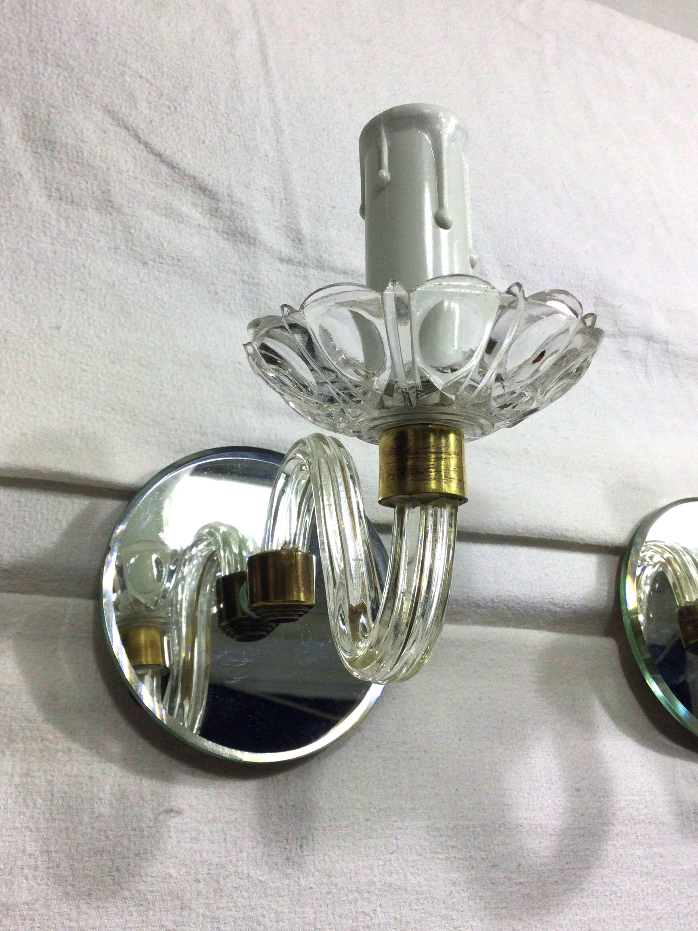 Pair of glass and mirror sconces