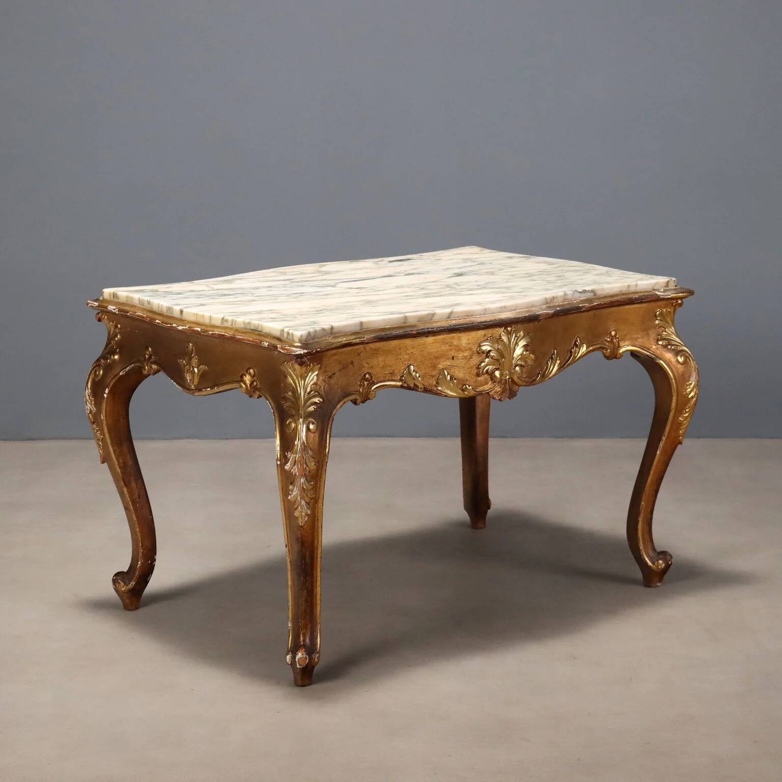Small antique baroque-style table in carved fir and marble from the 19th century.