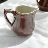 Brown ceramic teapot and milk jugs