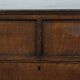Antique English oak commode dating from the late 18th century.