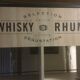 Store display for whisky and rum in metal and melamine