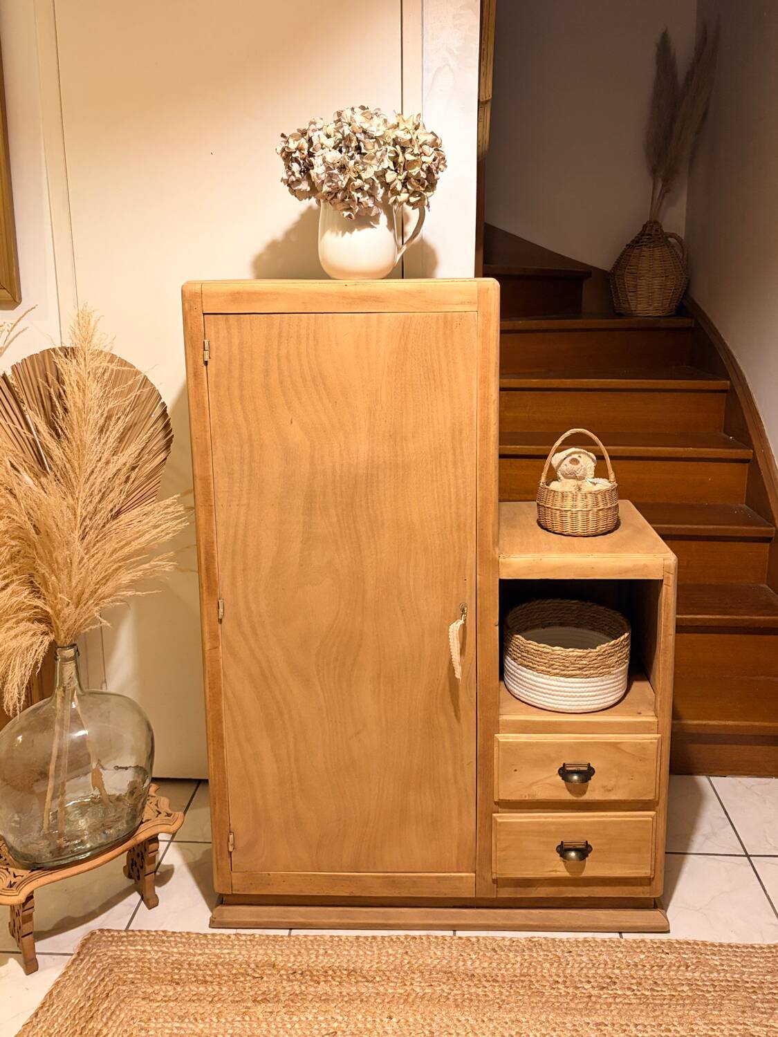 Asymmetrical cabinet made of raw wood