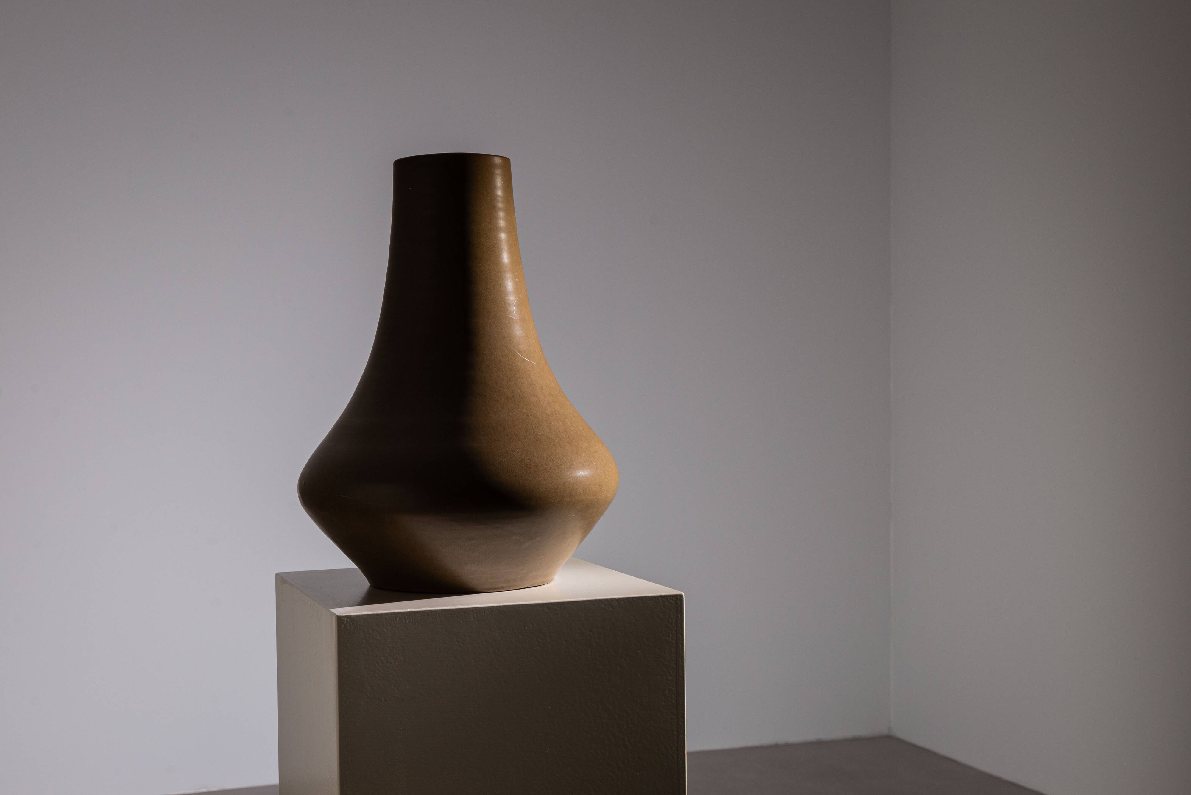 Minimalist curved stoneware vase in matte sand finish
