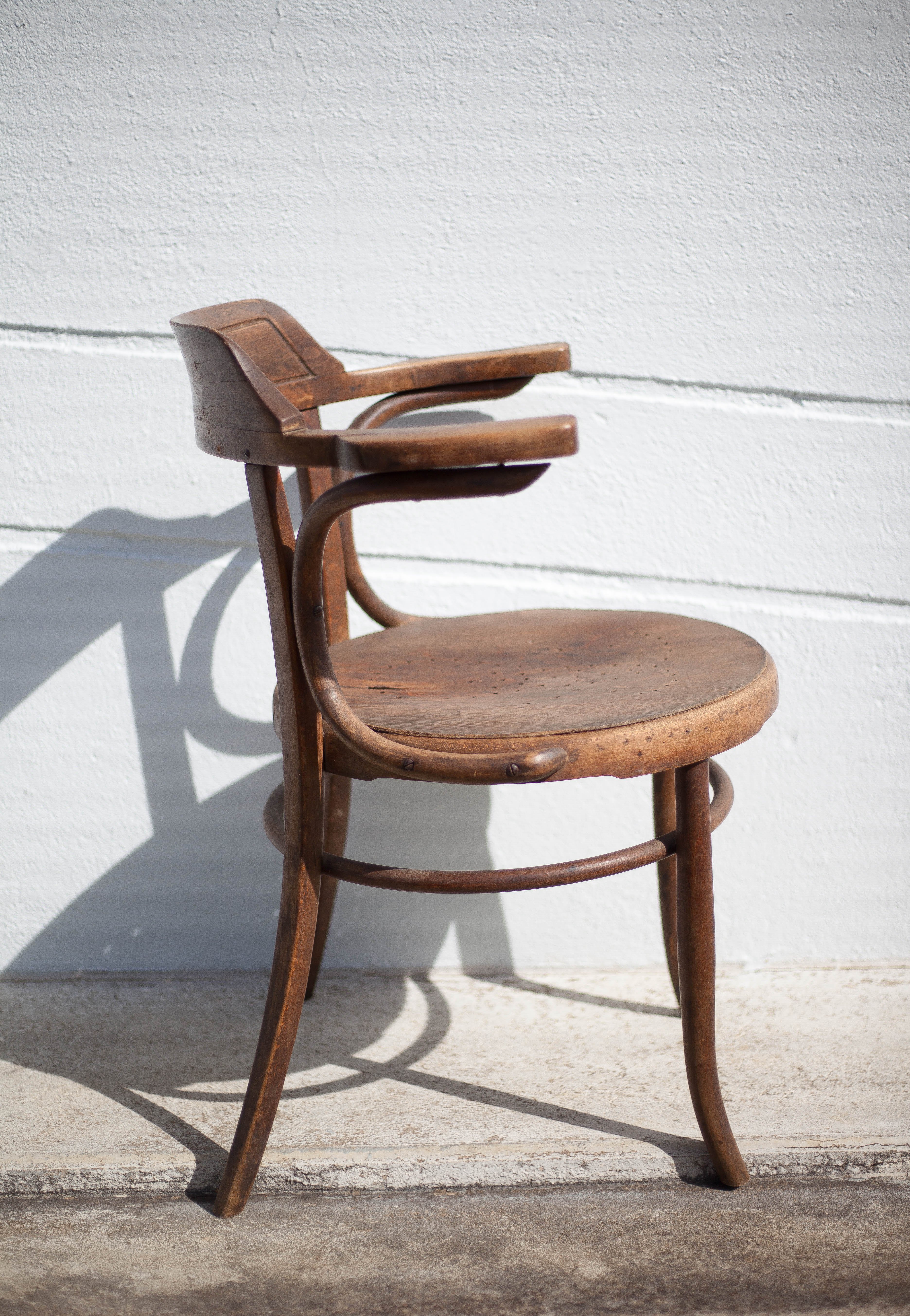 Curved wooden armchair Mundus vienna Austria, curved wooden chair, living room, bookcase, 20's