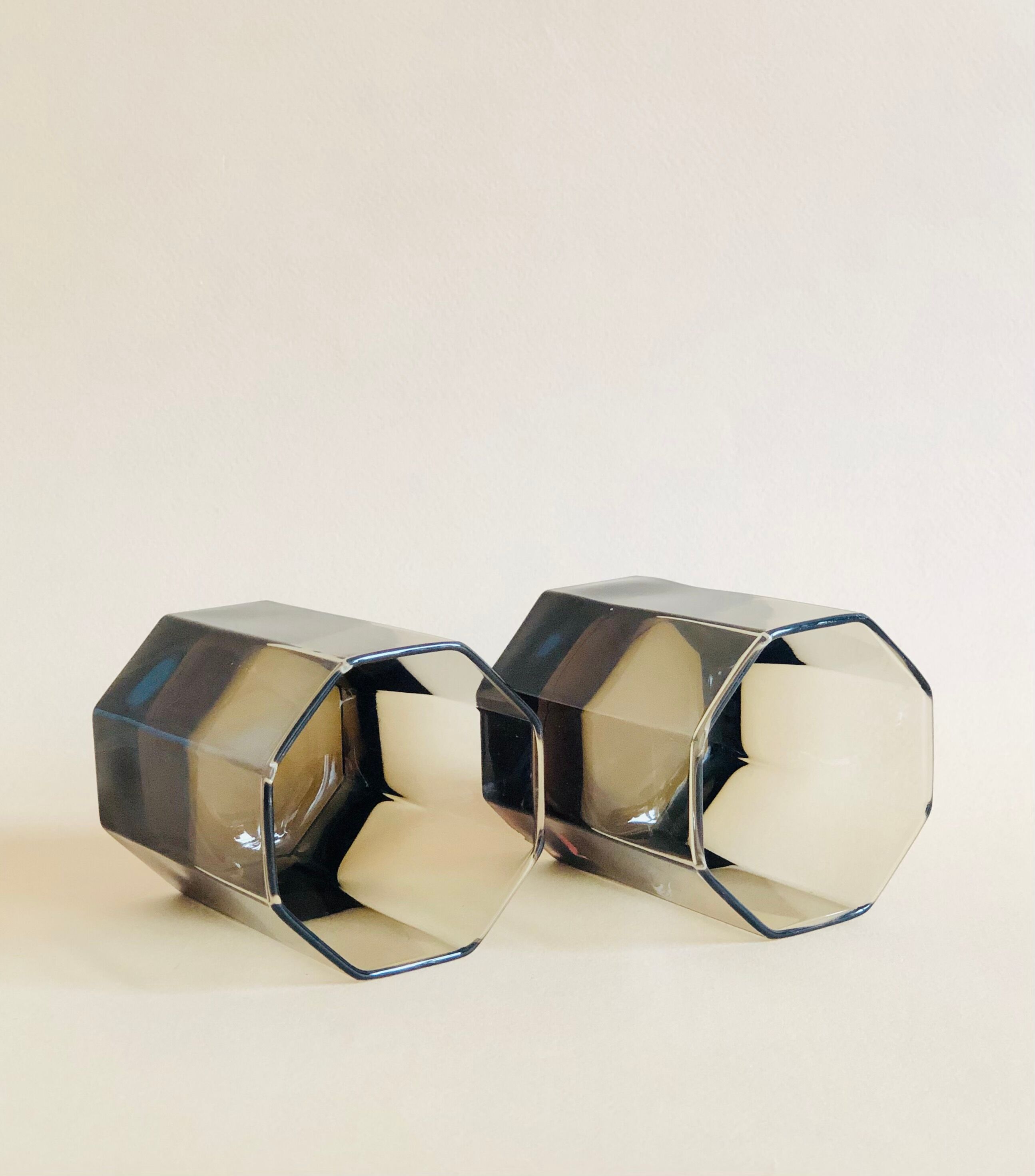 Pair of octagonal black glass whiskey glasses