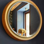 Backlit mirror designed by Gio Ponti in wood and lacquer. Italy, 1970s.