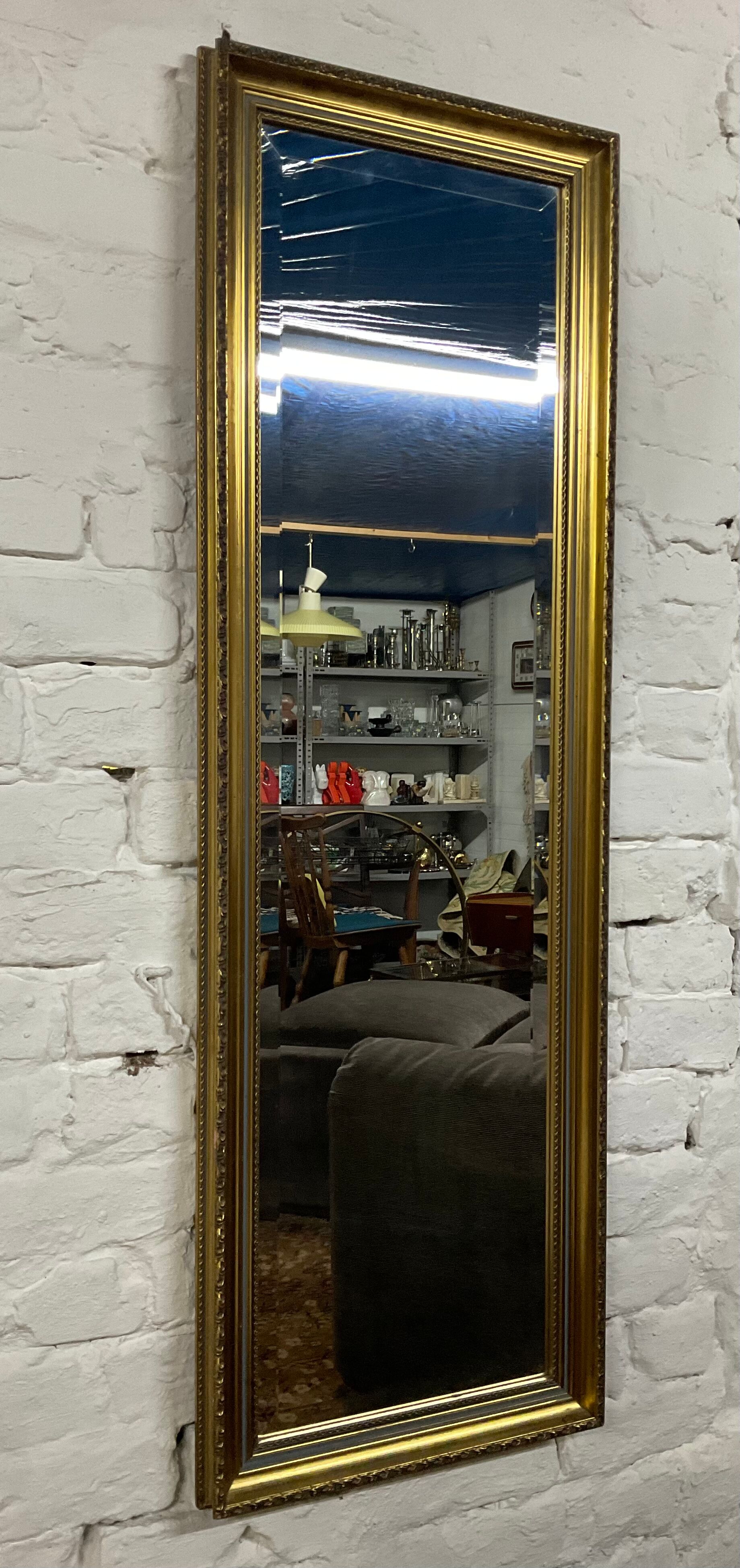 Vintage mirror in gilded wood and beveled glass
