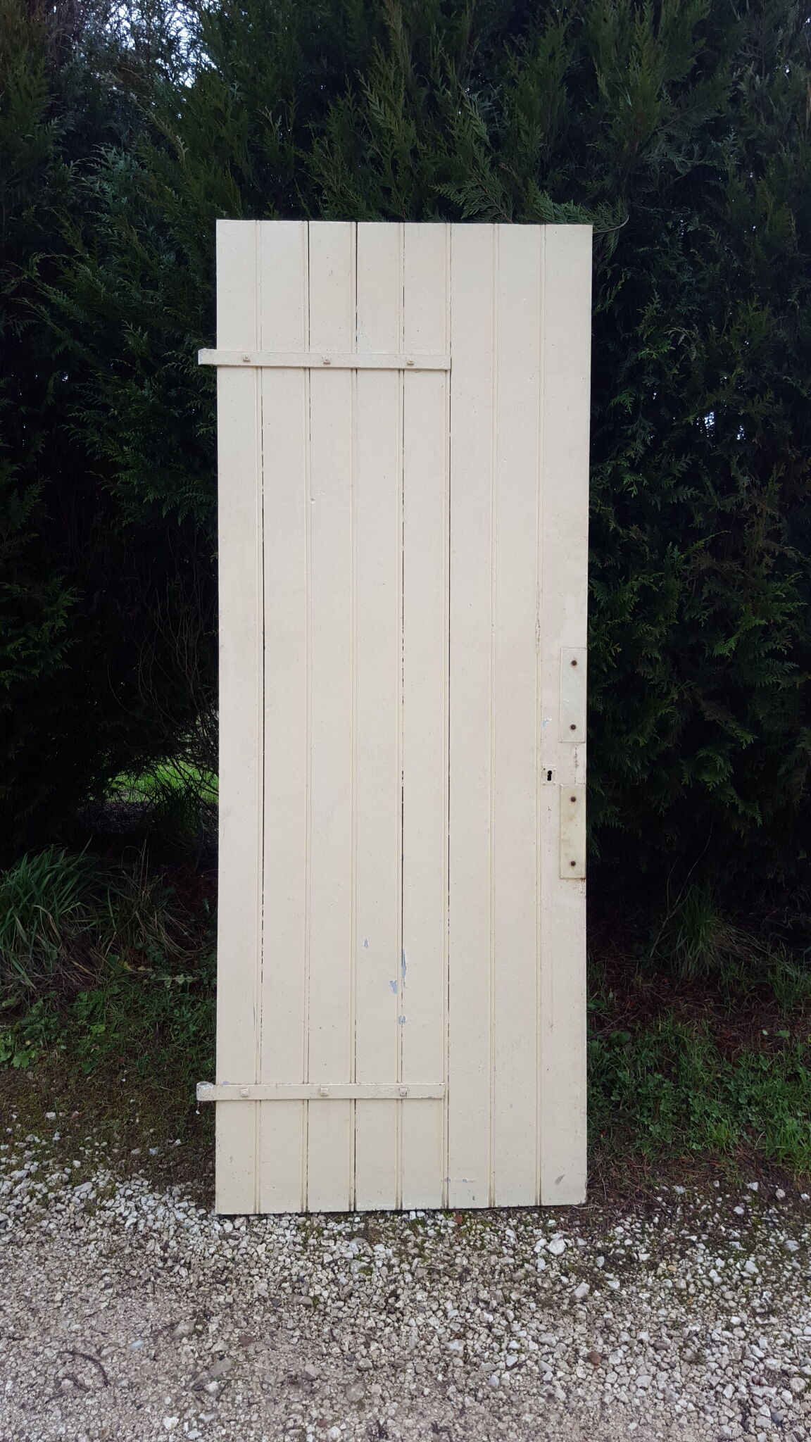 Old door in cream lacquered wood