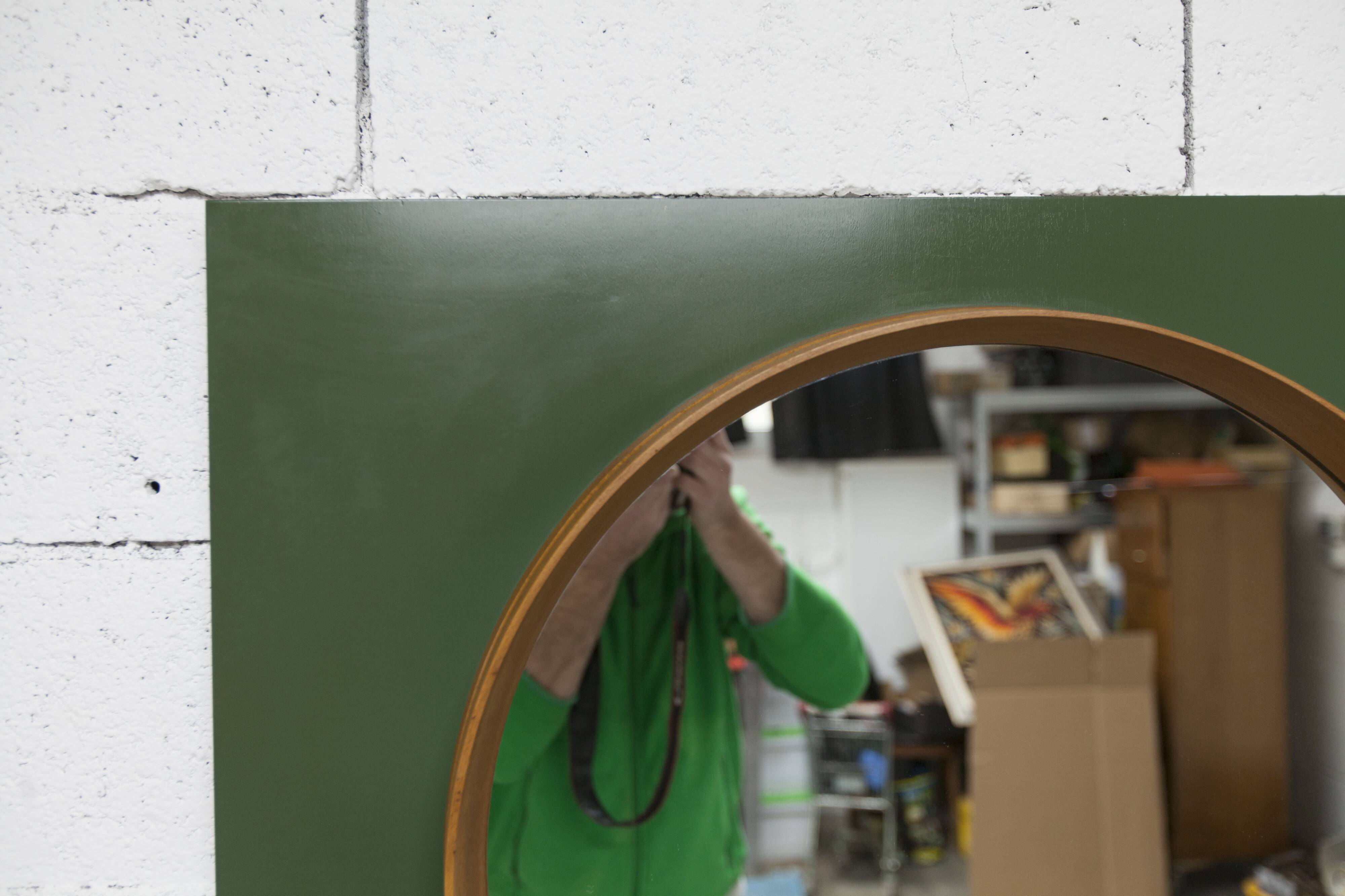 Unusual round wall mirror 60 cm teak edge on green rectangular board 1960.