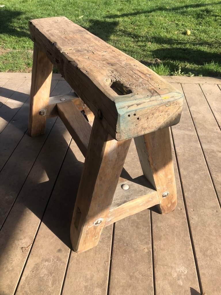 Trestle-shaped wooden bench