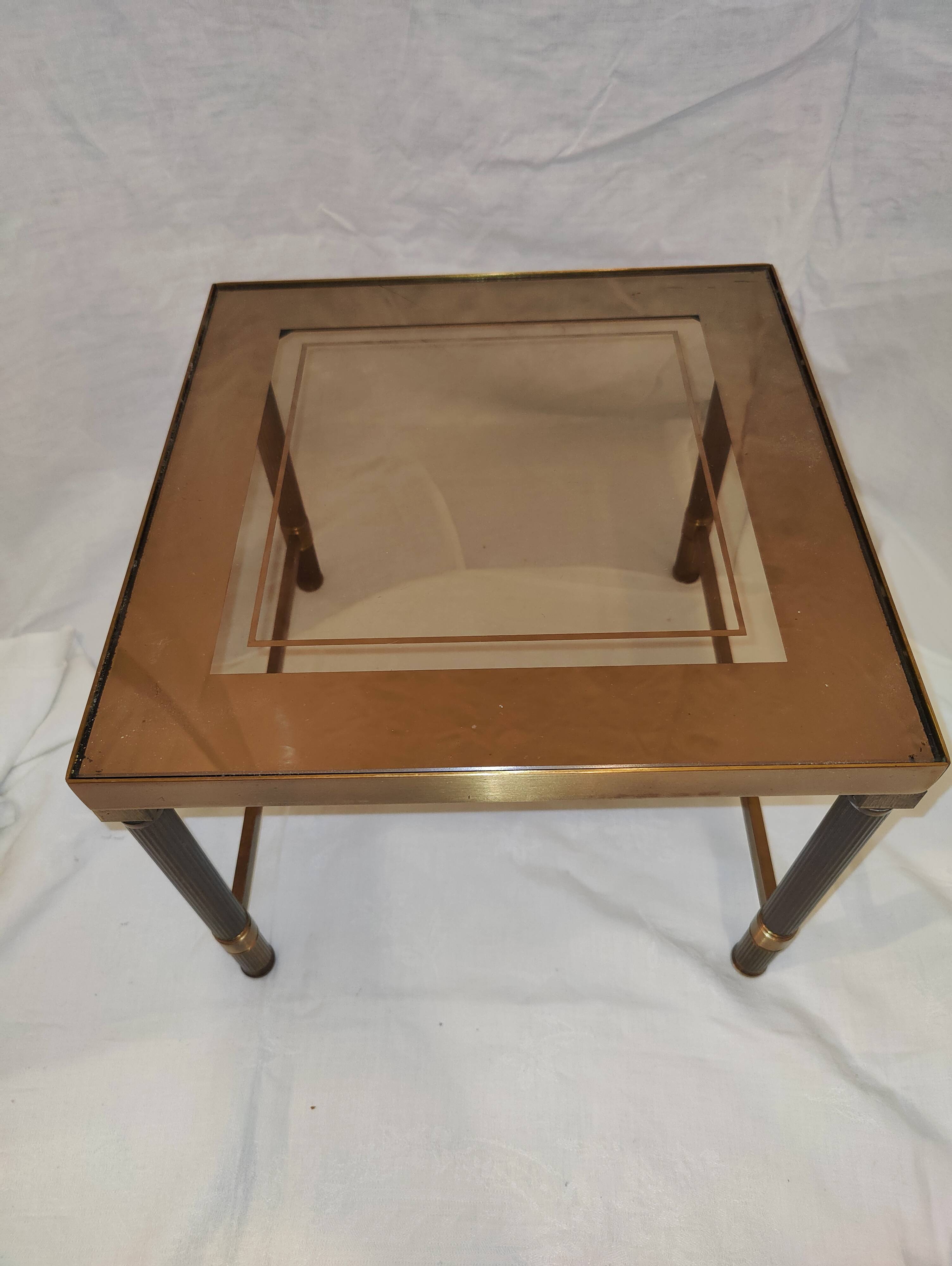 Small table or side table with brass structure and glass top from the 1970s.