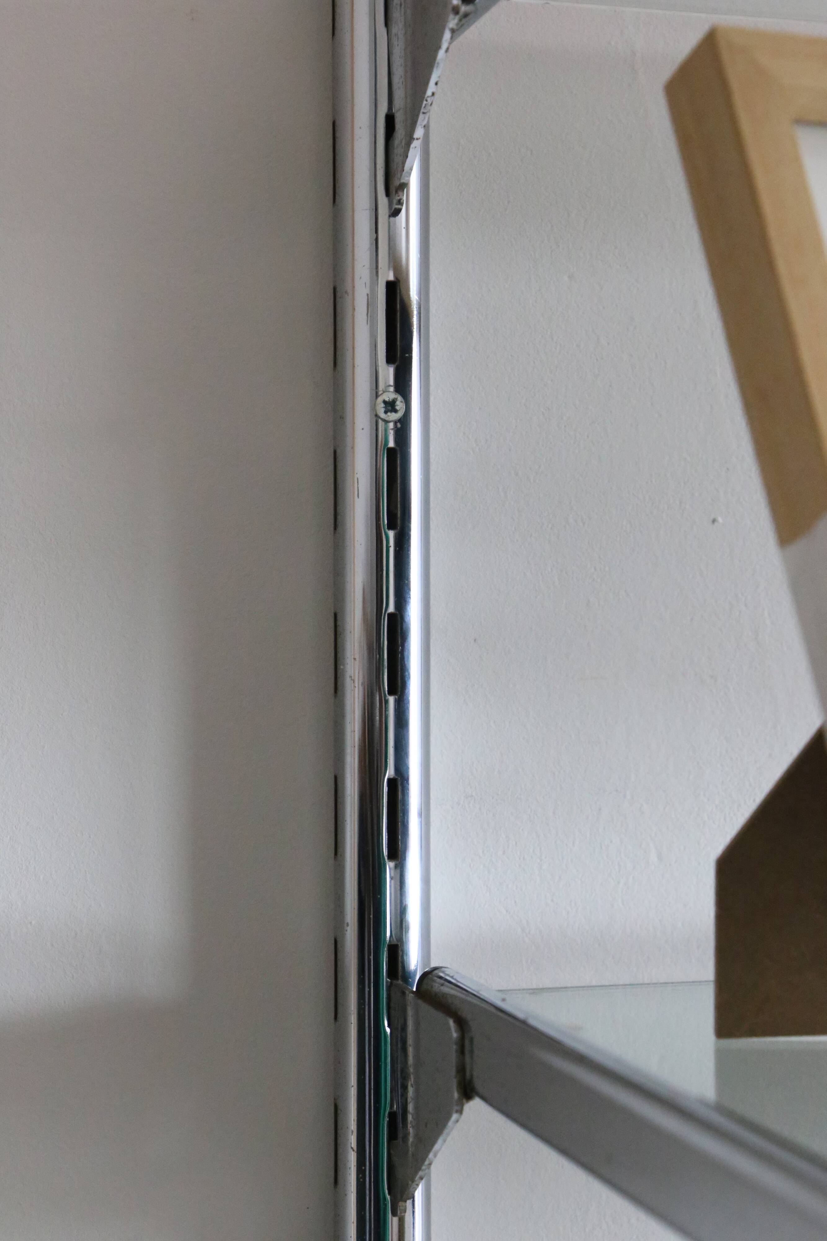 Chrome and glass wall shelf, circa 1960