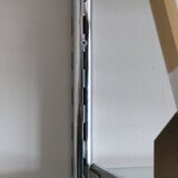 Chrome and glass wall shelf, circa 1960