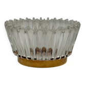 Crown coupe in ribbed glass with a brass base.