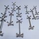 Eleven 70s design metal "crosshair" knife holders