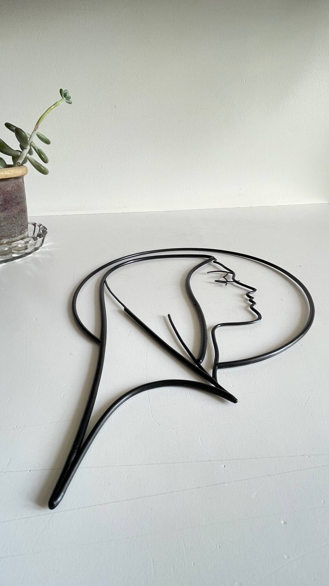 Vintage modernist wall decoration image of Saint.