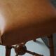 Turned wooden stool with leather seat, mid-20th century, Danish modern.