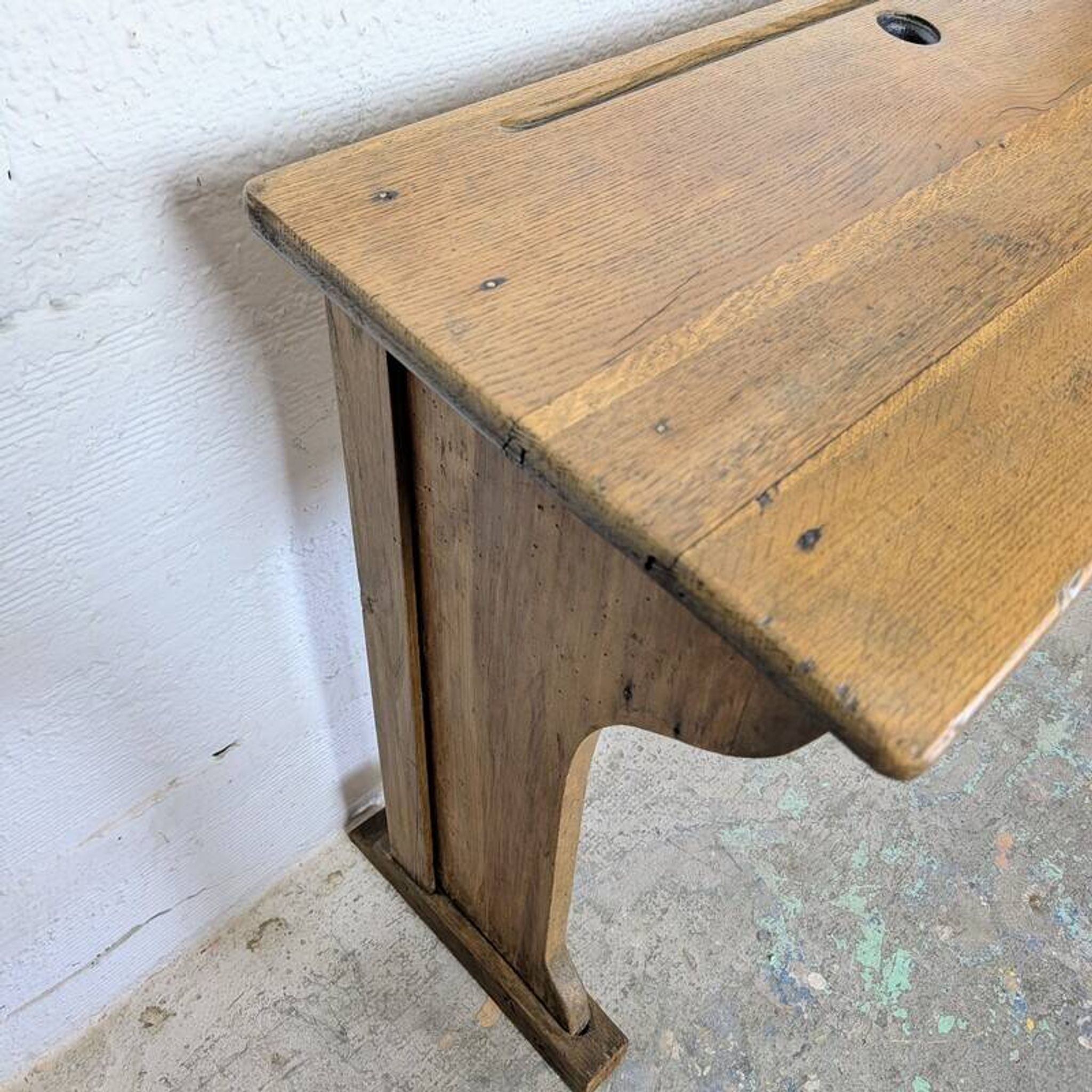 Double school desk and its wooden bench