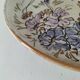 Stoneware plate with hand-painted floral decoration