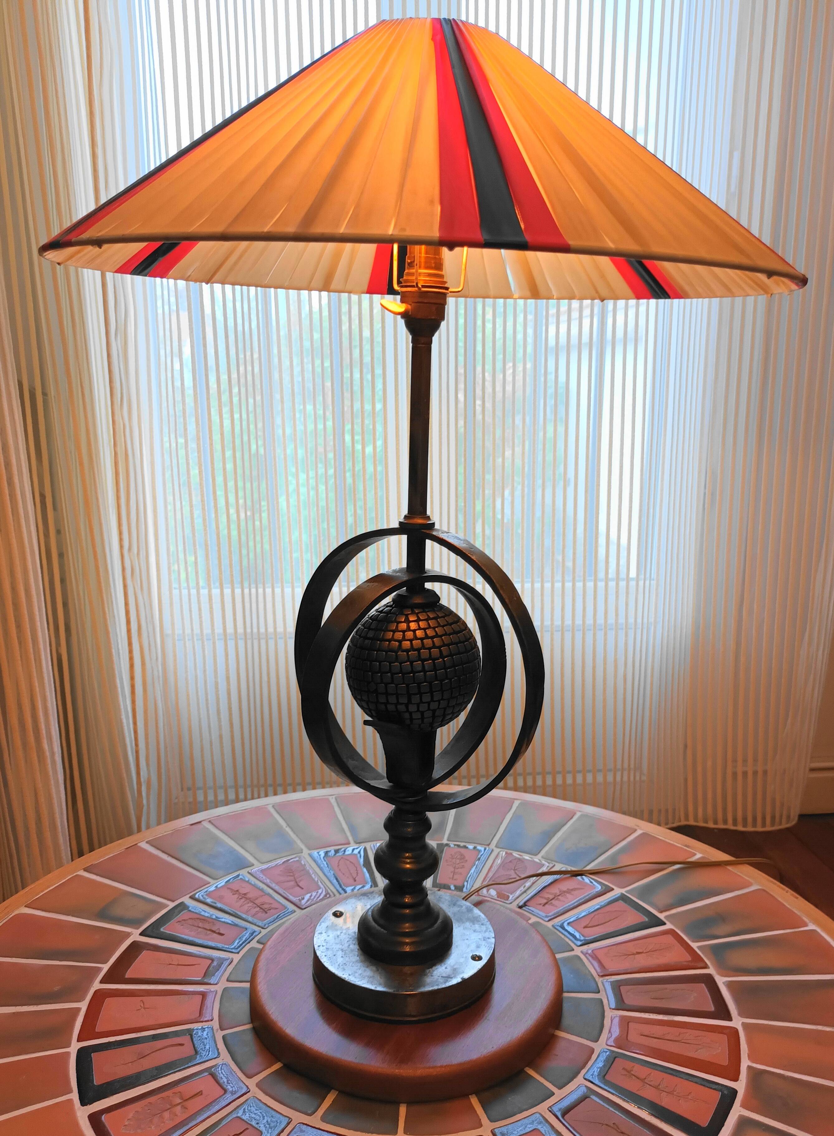 Wrought iron lamp with armillary sphere decorations