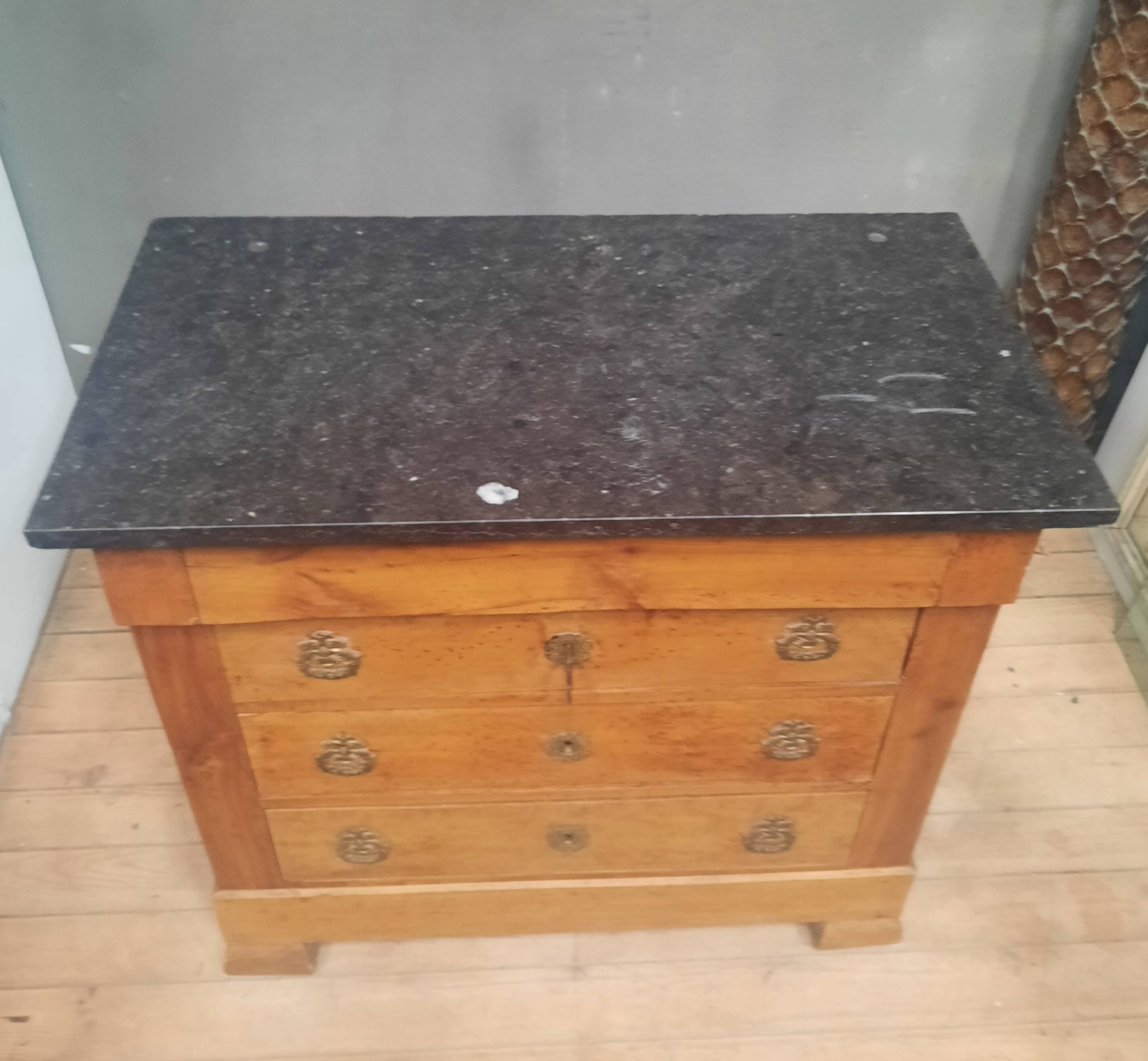 Nineteenth-century commode with marble top.