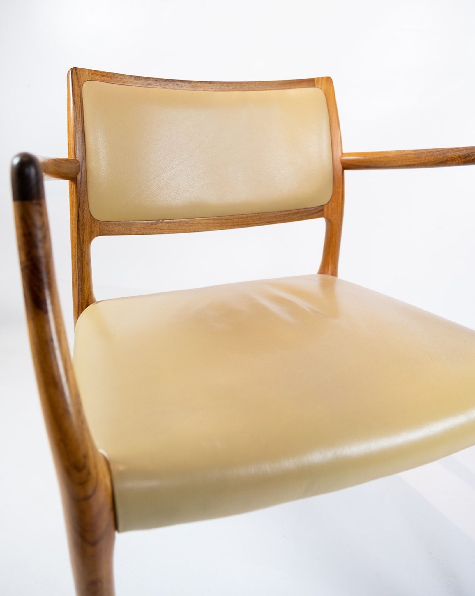 Pair of N.O. Moeller armchairs, model 65, in rosewood and light leather