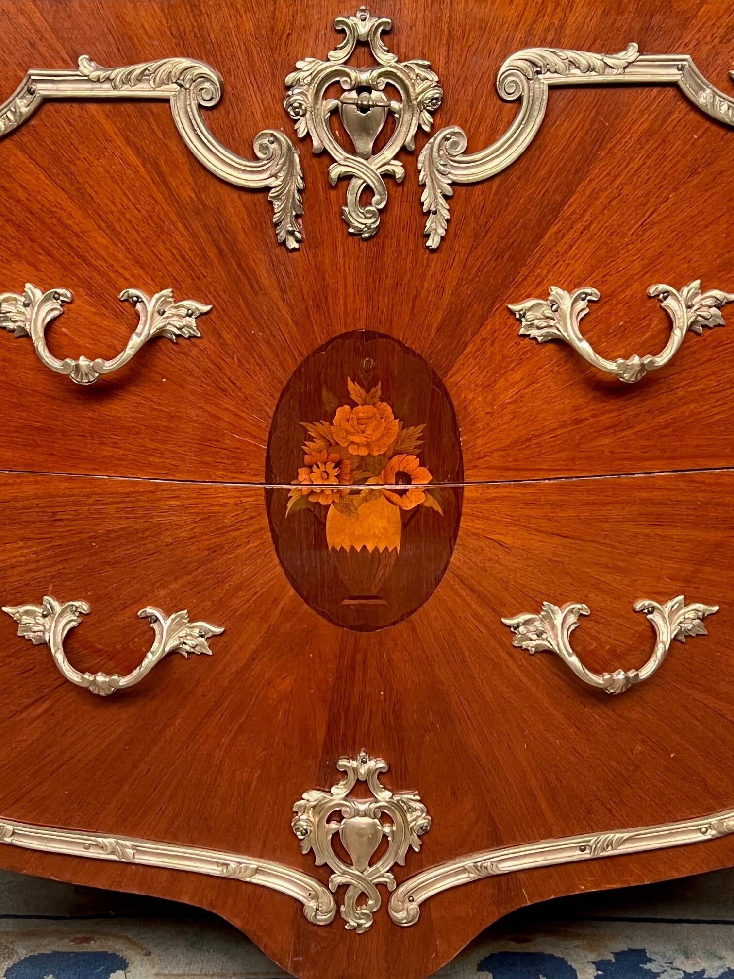 Louis XV style commode. Marquetry, gilded bronze decoration.