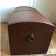 Ancient wooden and faux leather trunk