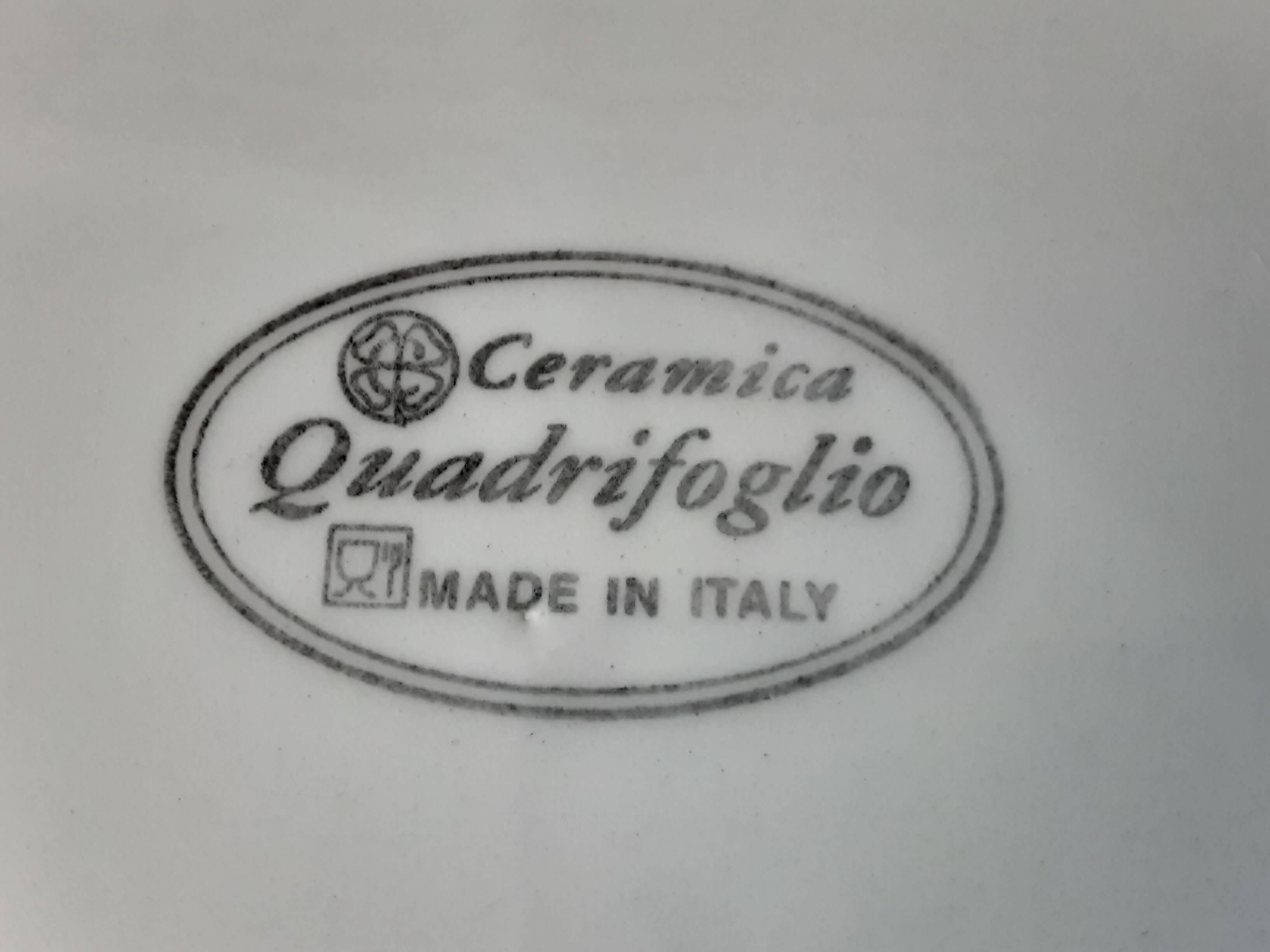 Quadrifoglio dish. Italian. Fruit and flower decoration. Shimmering colors.