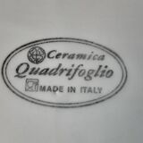 Quadrifoglio dish. Italian. Fruit and flower decoration. Shimmering colors.