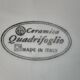 Quadrifoglio dish. Italian. Fruit and flower decoration. Shimmering colors.
