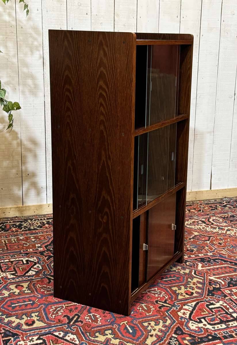 Small English oak library from the 1960s with sliding doors.