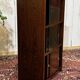 Small English oak library from the 1960s with sliding doors.