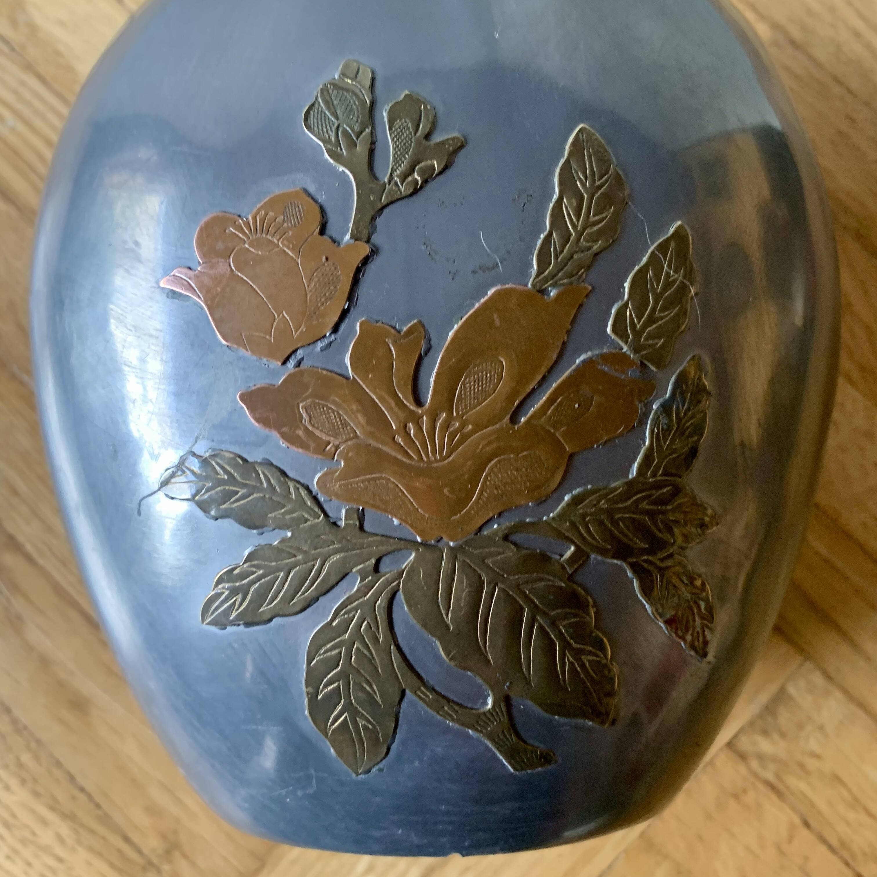 Small pewter vase decorated with brass flowers