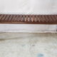 Bench with slats and feet of charpoy beds in teak