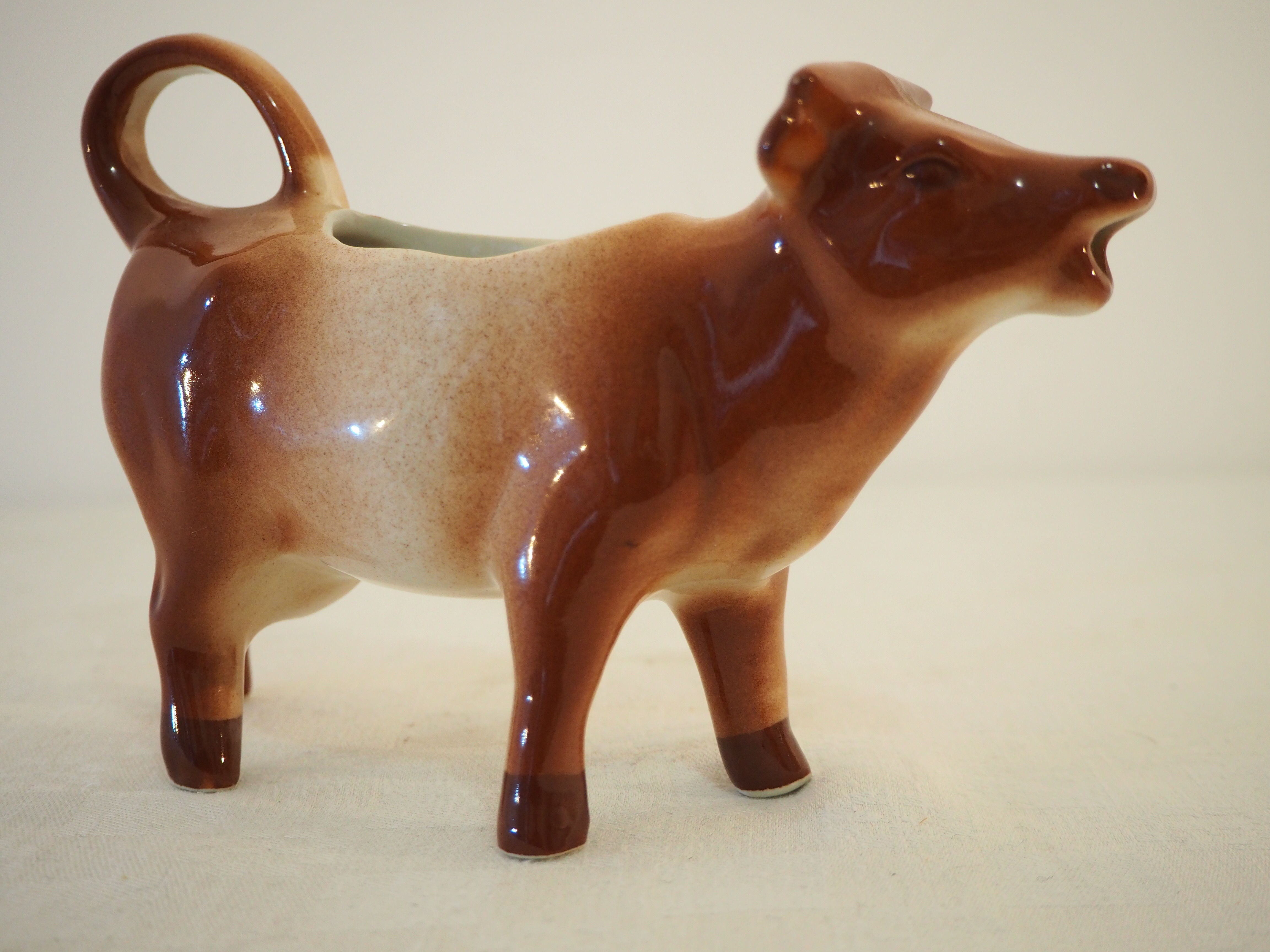 Milk jar in the shape of a vintage ceramic cow