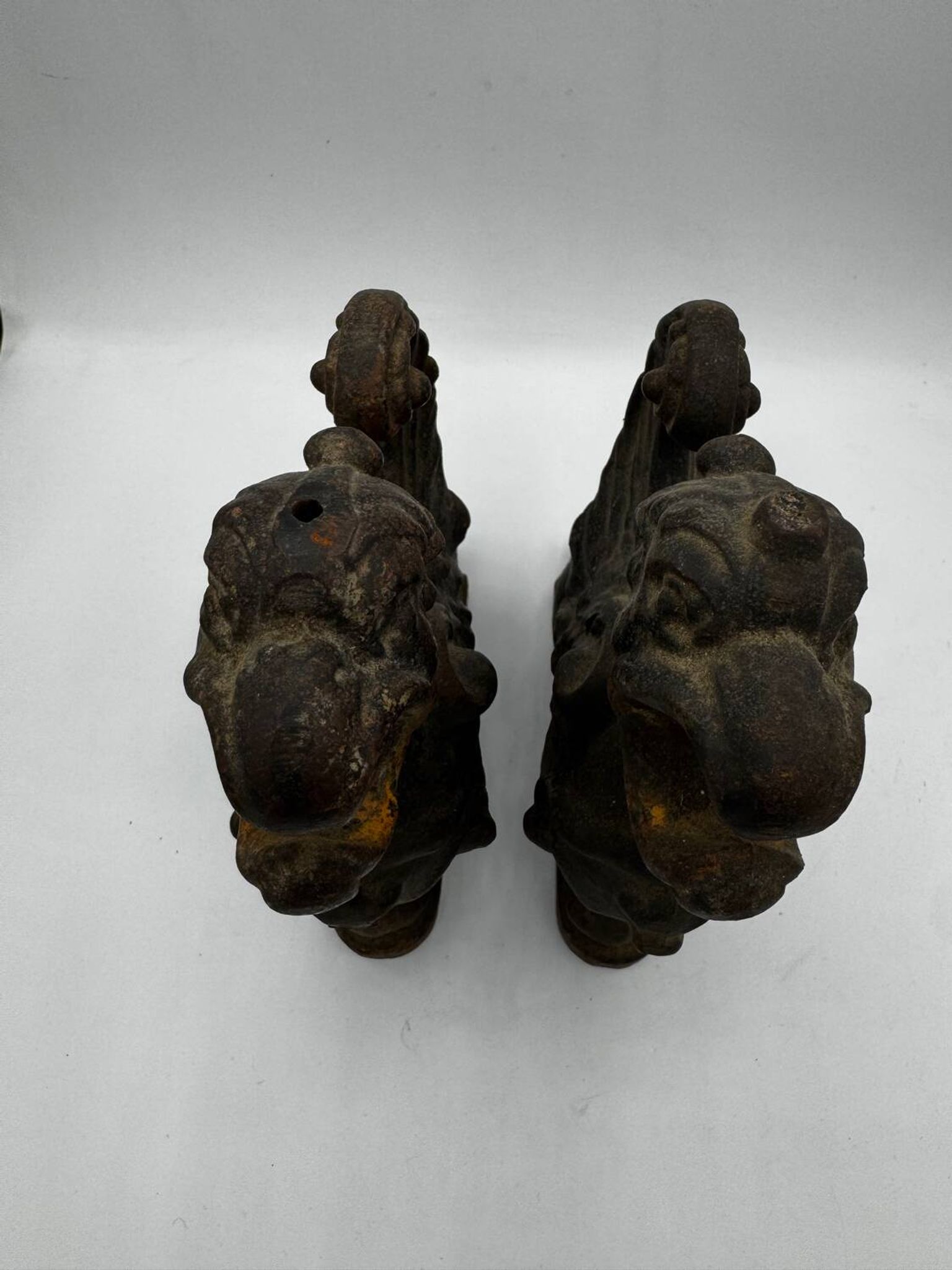 Pair of winged chimera and dragon fire dogs in cast iron