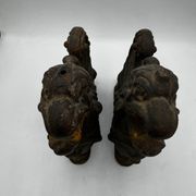 Pair of winged chimera and dragon fire dogs in cast iron