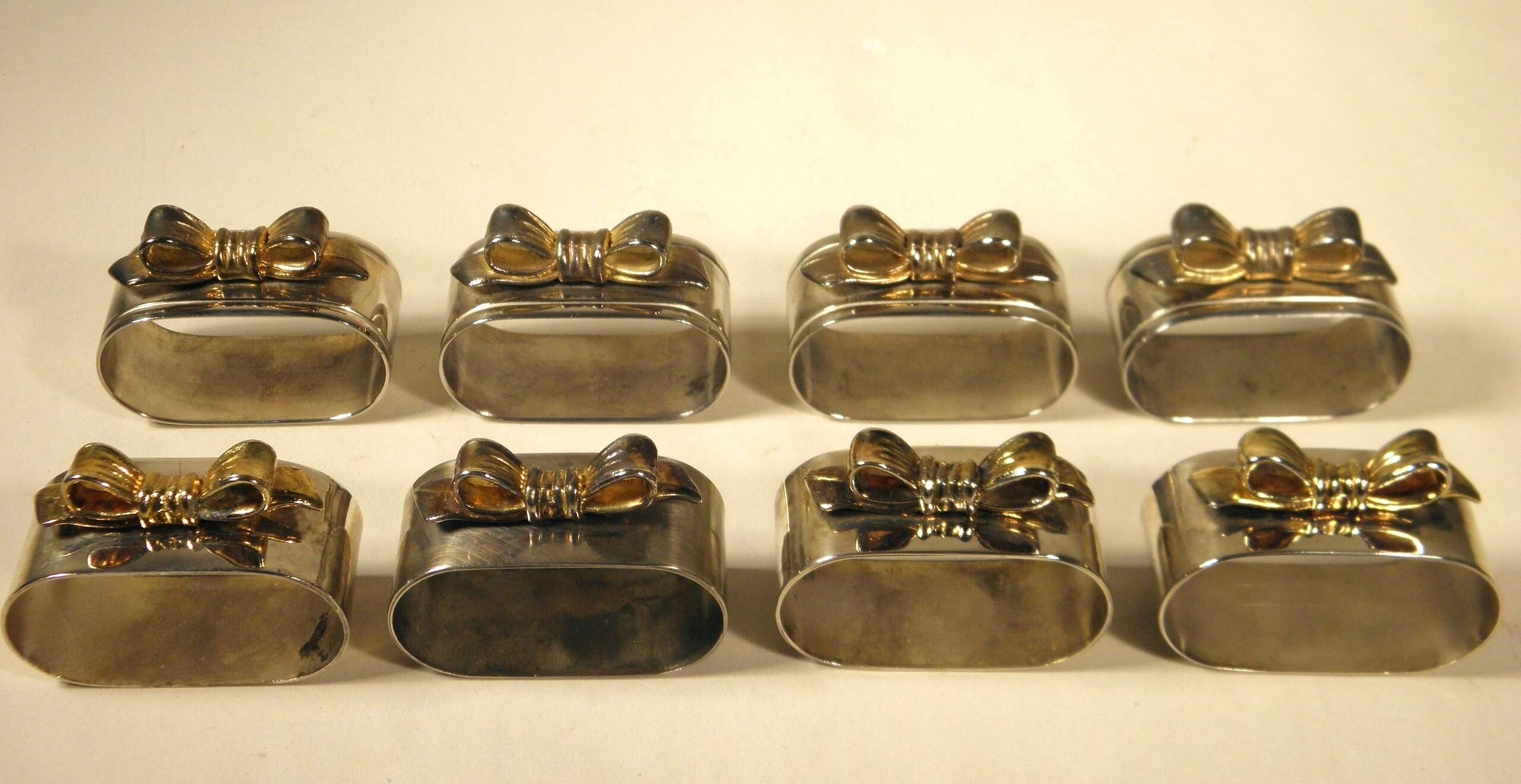 8 silver and gold napkin rings