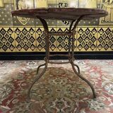 Wrought iron garden table with round top