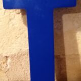 Vintage sign letter T in blue plexiglass