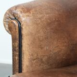 Sturdy vintage sheepskin club armchair with a beautiful patina