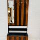 Vintage wall coat rack with storage bench from the 1970s.
