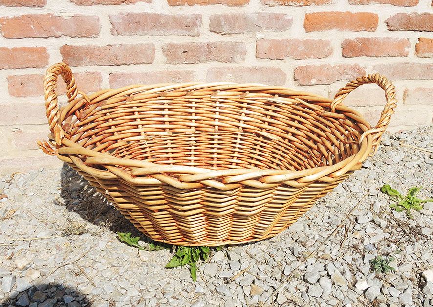 Old oval wicker linen basket, light rattan